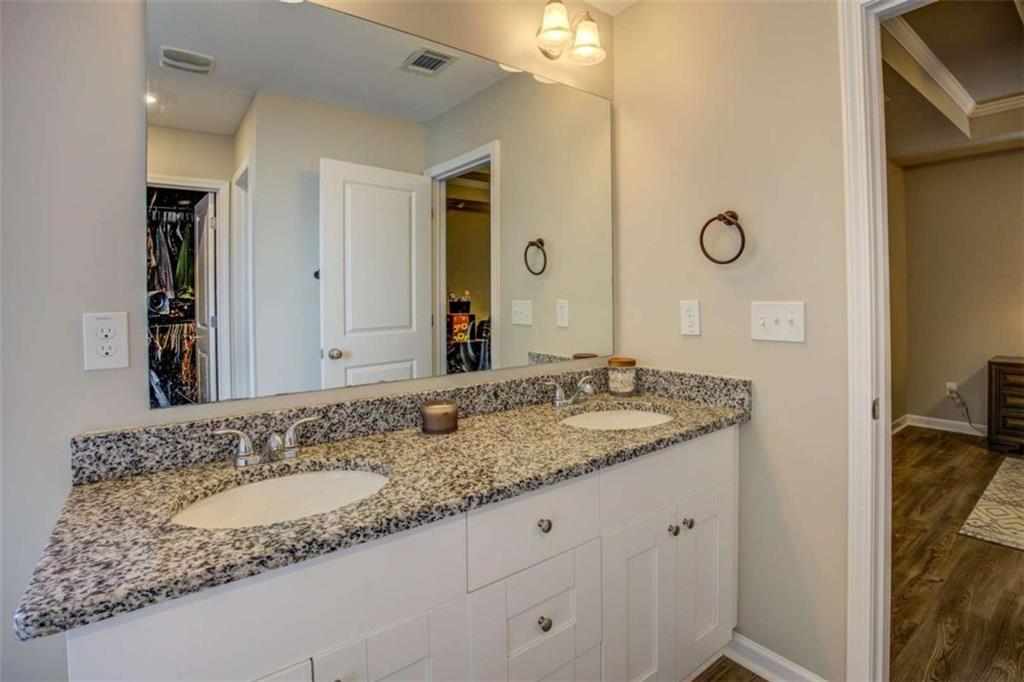160 Savannah Way Milner, GA 30257 - Photo 20 of 41 a bathroom with a granite countertop sink and a mirror