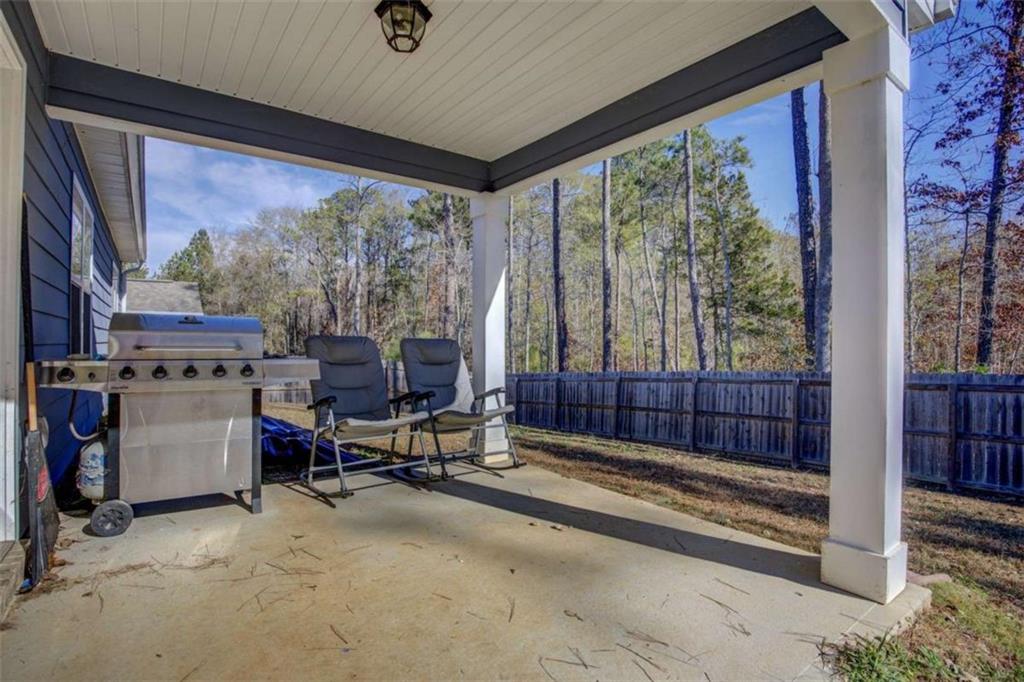 160 Savannah Way Milner, GA 30257 - Photo 30 of 41 a view of a room with gym equipment and floor to ceiling windows