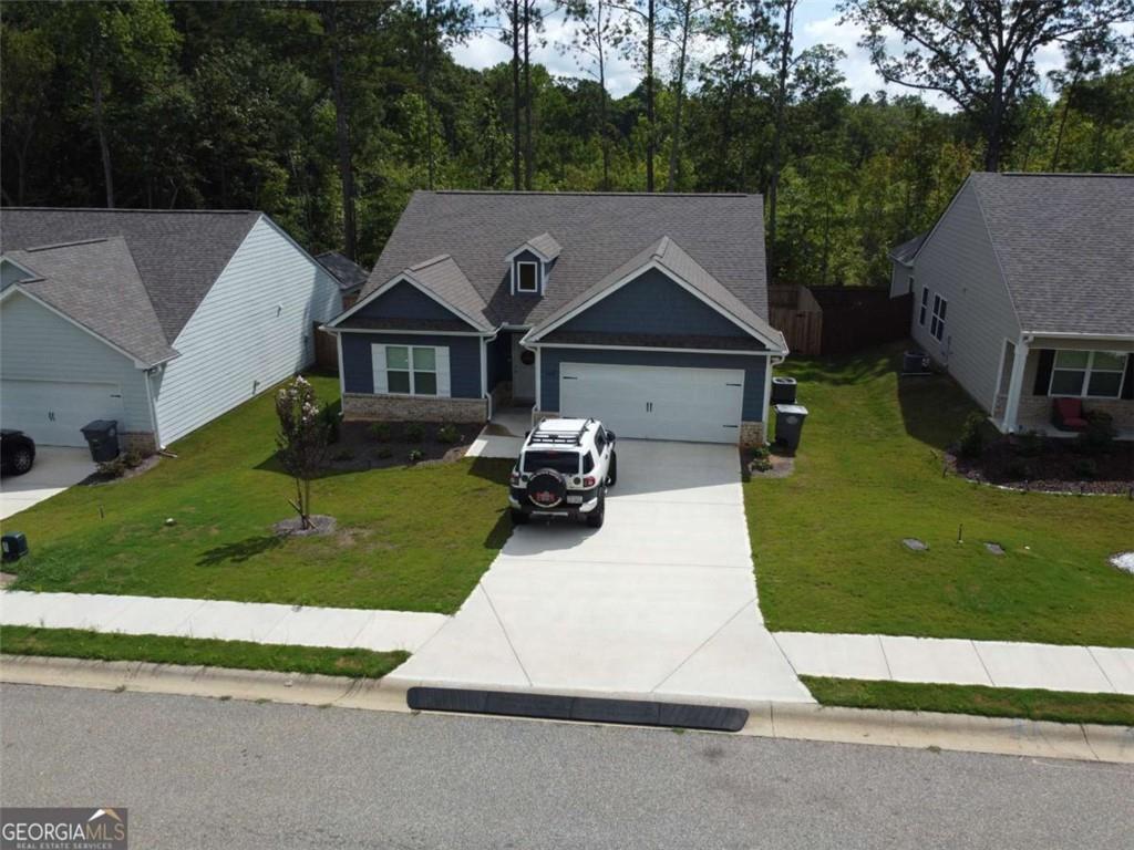 160 Savannah Way Milner, GA 30257 - Photo 39 of 41 front view of a house with a yard