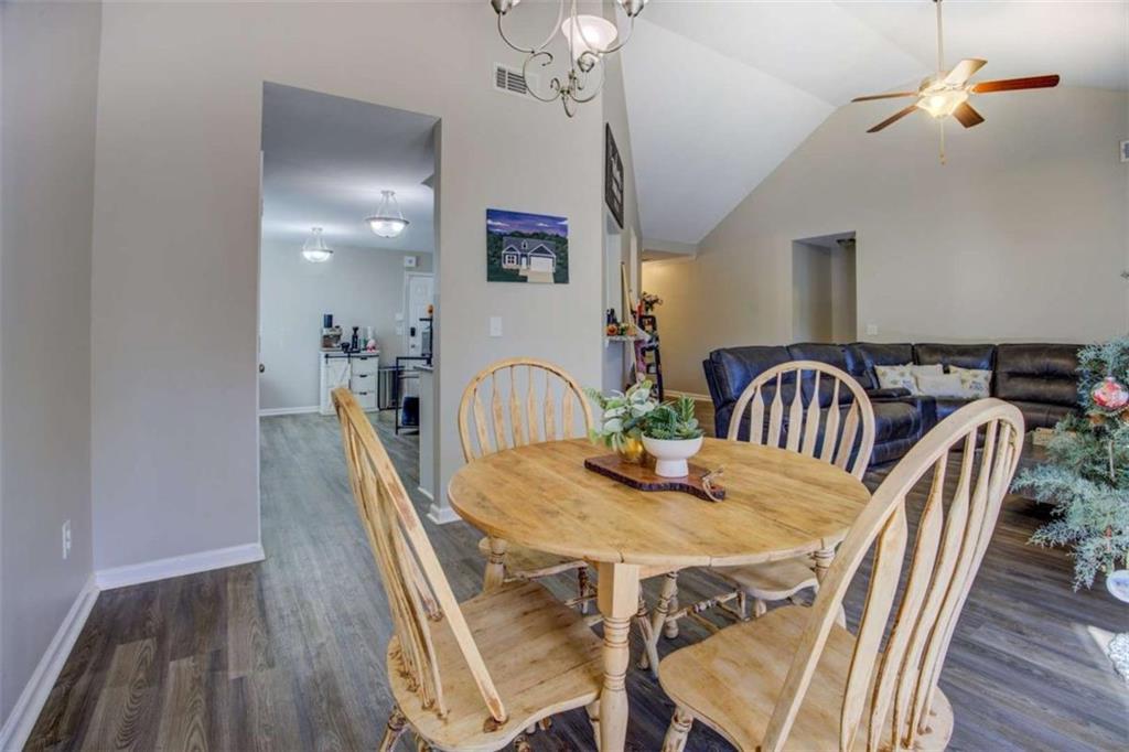 160 Savannah Way Milner, GA 30257 - Photo 7 of 41 a view of a dining room with furniture and chandelier