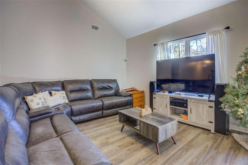 160 Savannah Way Milner, GA 30257 - Photo 8 of 41 a living room with furniture and a flat screen tv