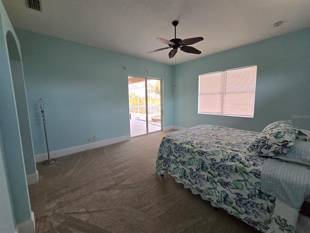 14970 Appleton Boulevard Port Charlotte, FL 33981 - Photo 19 of 48 a bedroom with a bed and a window