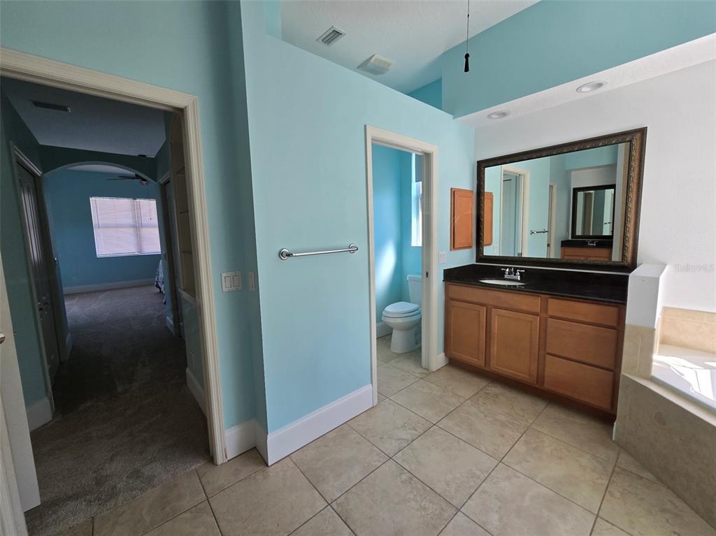 14970 Appleton Boulevard Port Charlotte, FL 33981 - Photo 24 of 48 a kitchen with a refrigerator and a sink