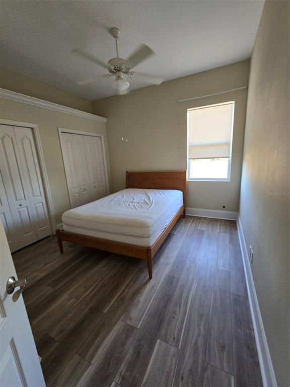 14970 Appleton Boulevard Port Charlotte, FL 33981 - Photo 26 of 48 a bedroom with a bed and wooden floor