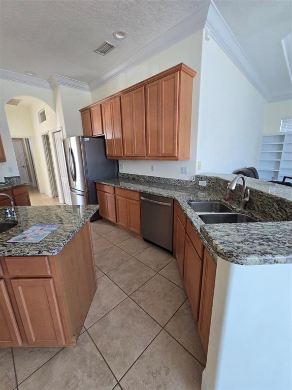 14970 Appleton Boulevard Port Charlotte, FL 33981 - Photo 31 of 48 a kitchen with stainless steel appliances granite countertop a sink stove and refrigerator