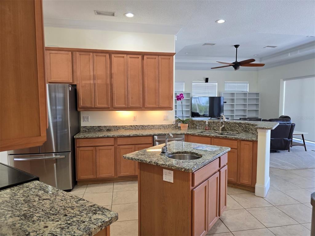 14970 Appleton Boulevard Port Charlotte, FL 33981 - Photo 35 of 48 a kitchen with stainless steel appliances granite countertop a sink stove and refrigerator
