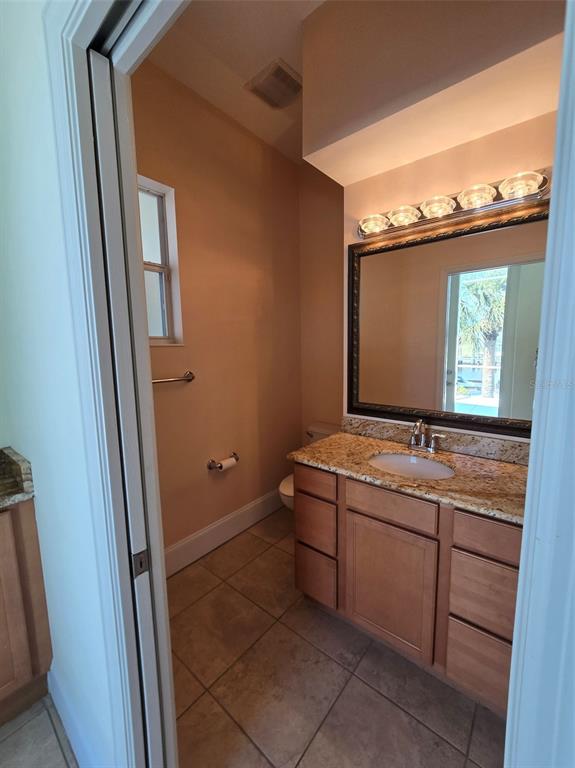 14970 Appleton Boulevard Port Charlotte, FL 33981 - Photo 39 of 48 a room with a sink and a mirror