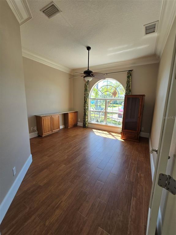 14970 Appleton Boulevard Port Charlotte, FL 33981 - Photo 42 of 48 wooden floor in an empty room with a window