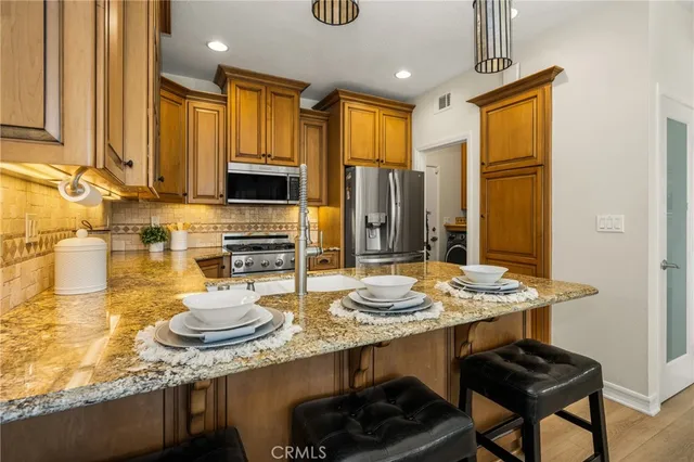 a view of balcony with two white chairs