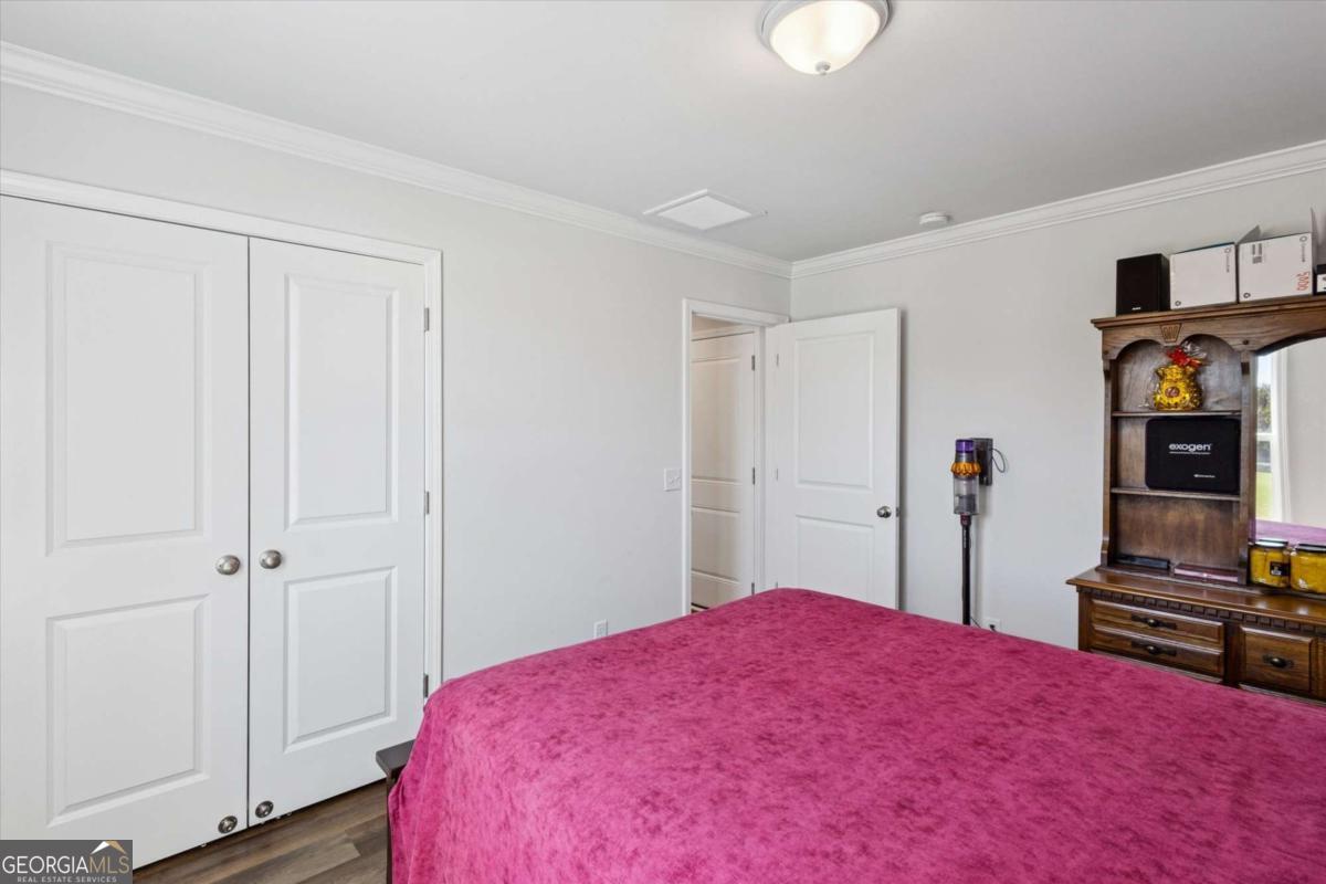 455 Tondee Way Midway, GA 31320 - Photo 26 of 52 a bedroom with a bed and a closet