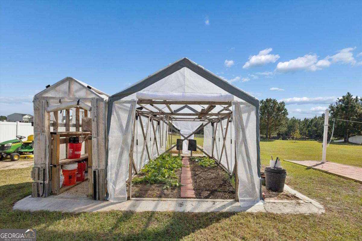 455 Tondee Way Midway, GA 31320 - Photo 44 of 52 a view of a house with a porch