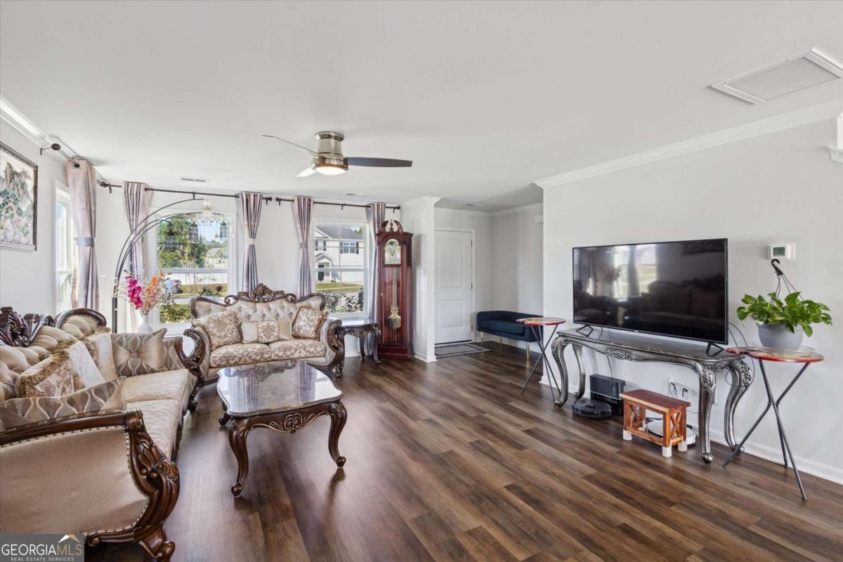 455 Tondee Way Midway, GA 31320 - Photo 6 of 52 a living room with furniture and a flat screen tv