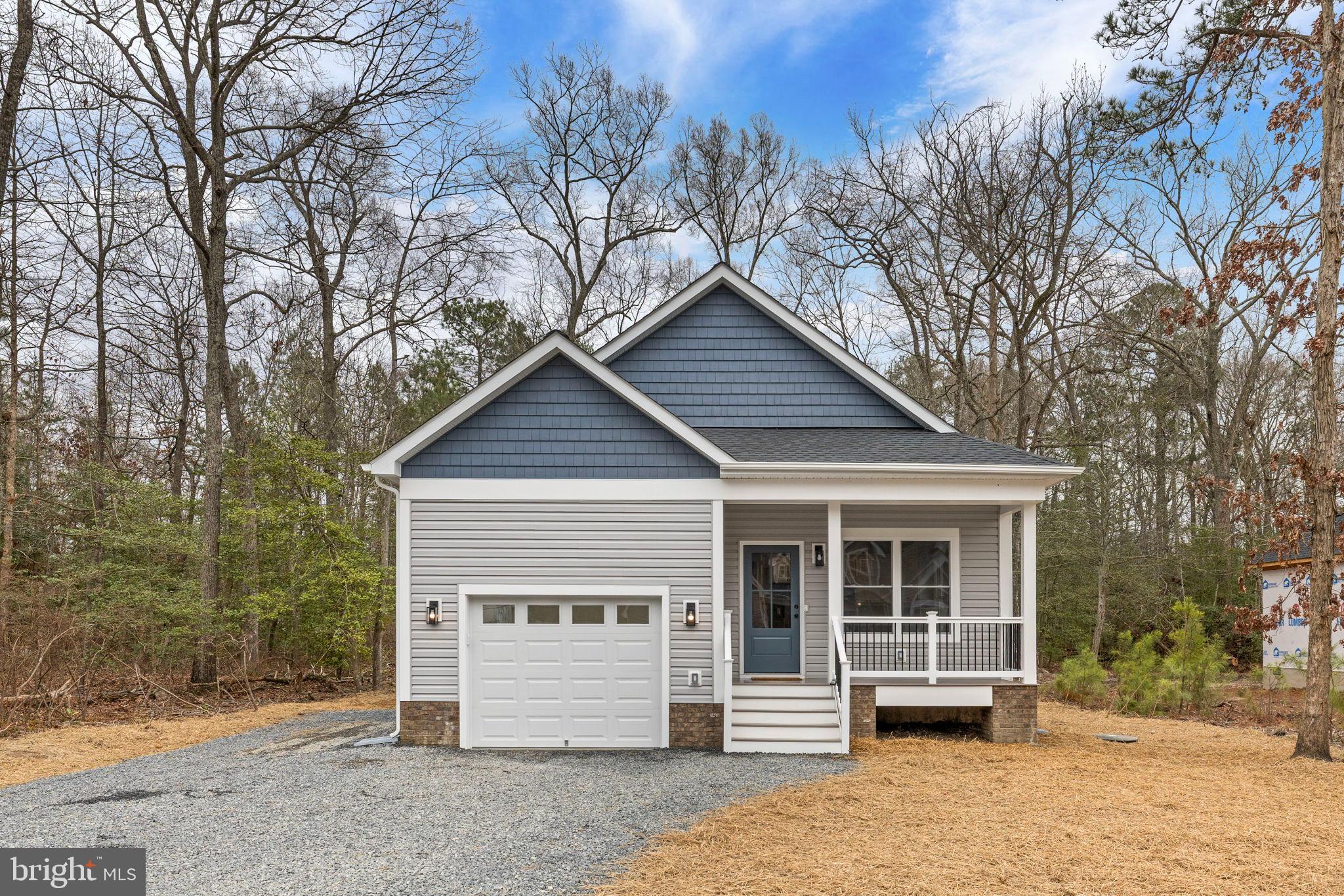312 9th Street Colonial Beach, VA 22443 - Photo 1 of 59 a front view of a house with a large window