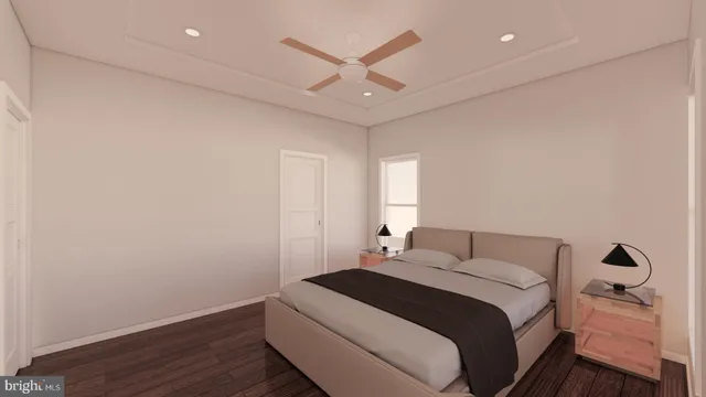 a bedroom with a large bed and a ceiling fan
