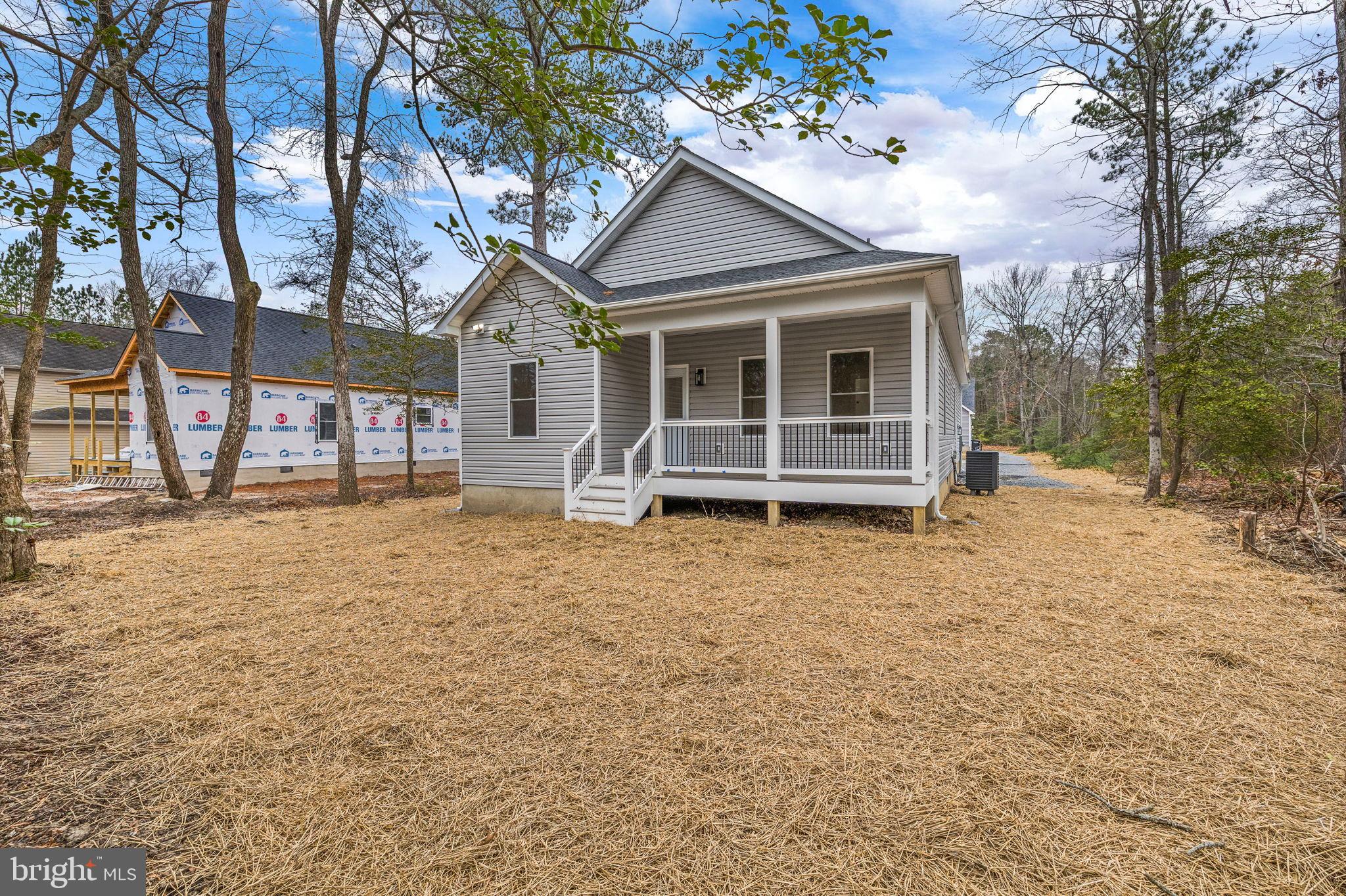 312 9th Street Colonial Beach, VA 22443 - Photo 26 of 59 a front view of a house with a yard