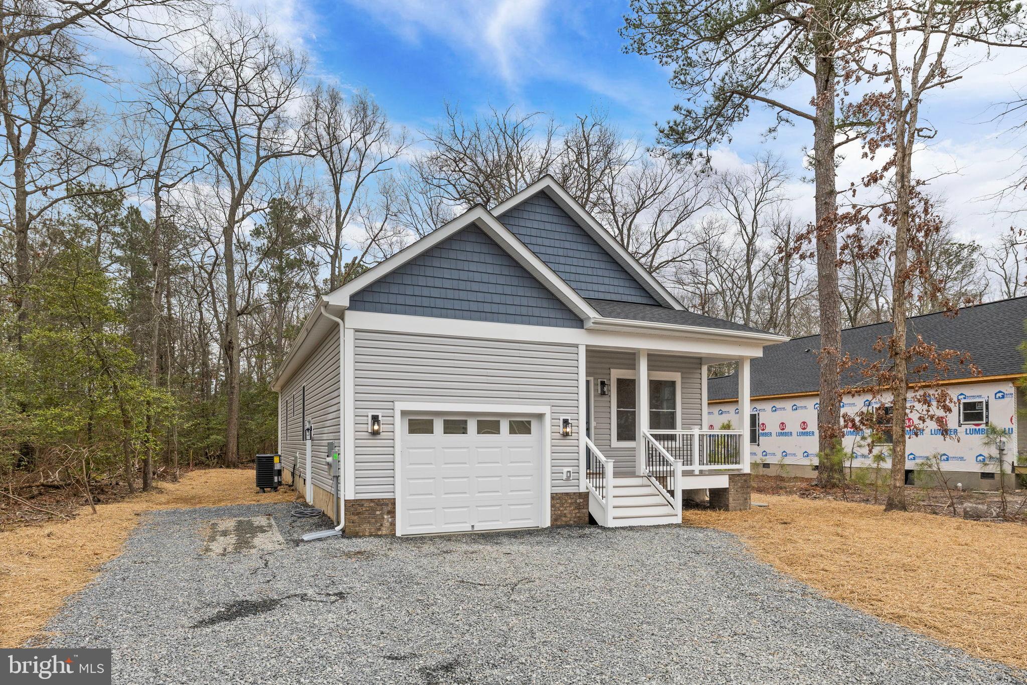 312 9th Street Colonial Beach, VA 22443 - Photo 30 of 59 a view of a house with a yard covered in snow