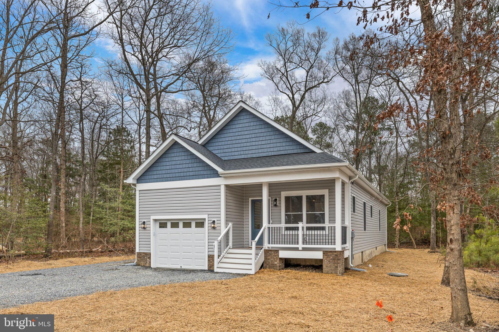 312 9th Street Colonial Beach, VA 22443 - Photo 3 of 59 a front view of a house with a yard