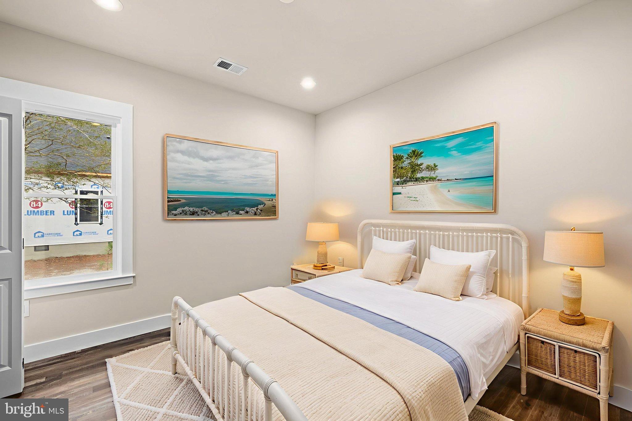 312 9th Street Colonial Beach, VA 22443 - Photo 5 of 59 a bedroom with a bed and a painting on the wall