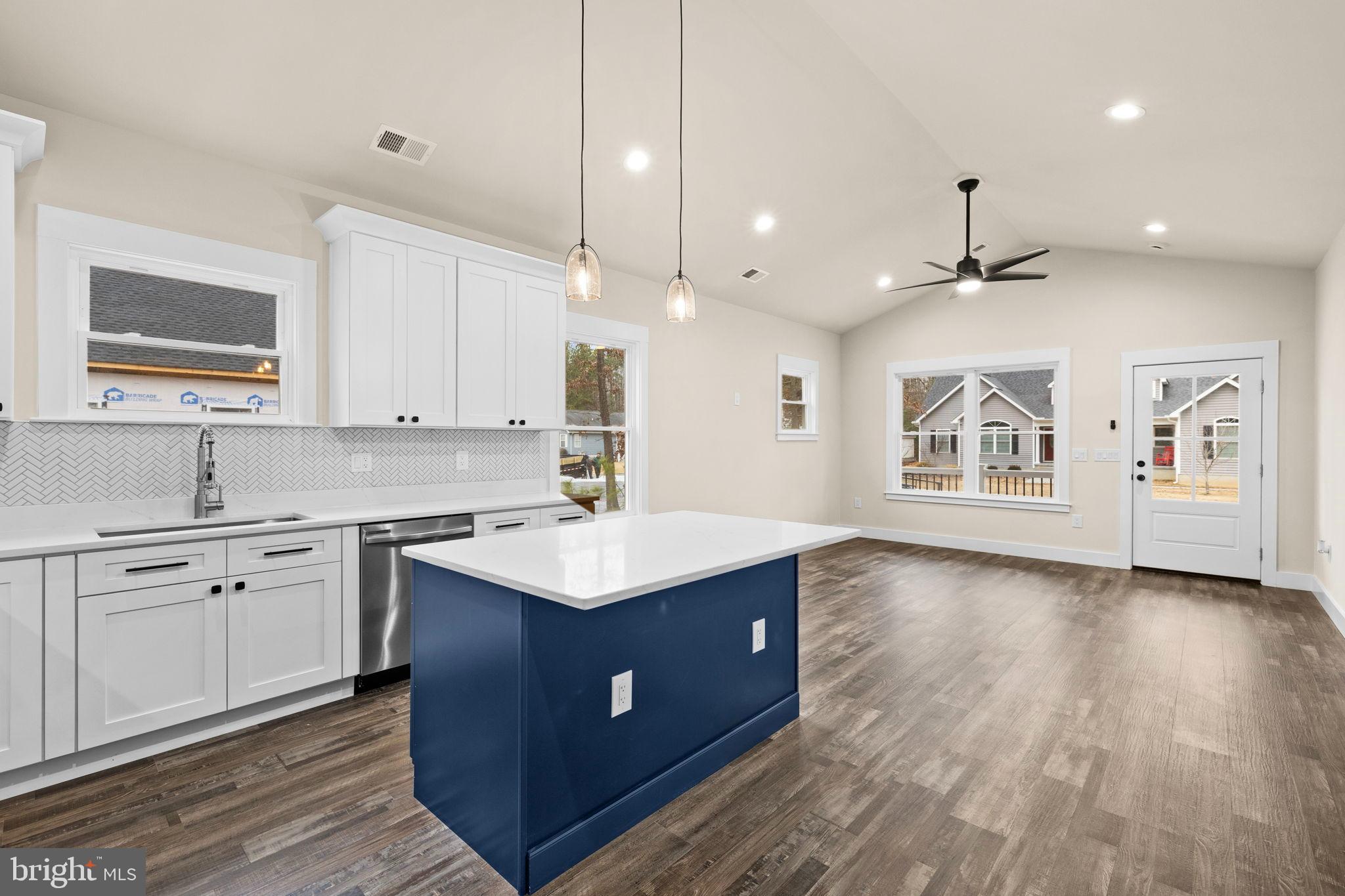 312 9th Street Colonial Beach, VA 22443 - Photo 59 of 59 a kitchen with a sink window and cabinets