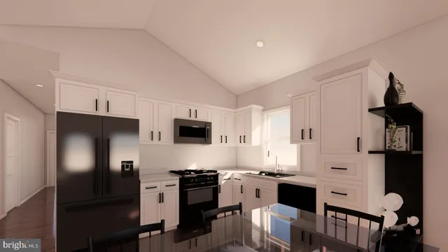 a kitchen with stainless steel appliances a stove refrigerator sink and microwave