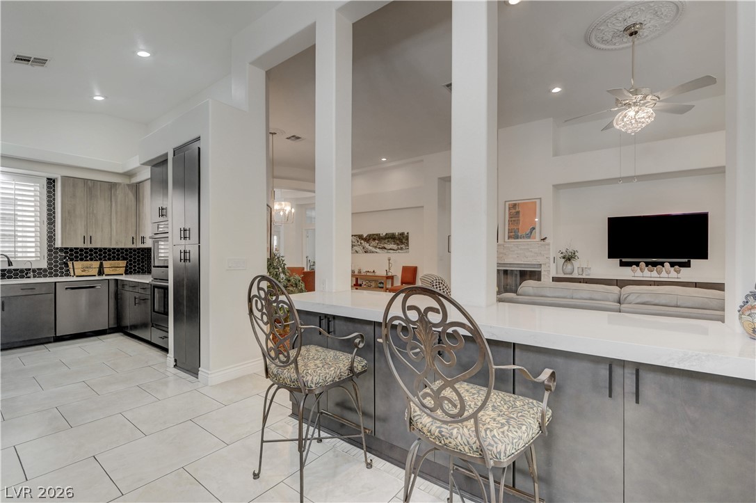 457 Indigo Springs Street Henderson, NV 89014 - Photo 14 of 58 Breakfast bar has added storage.