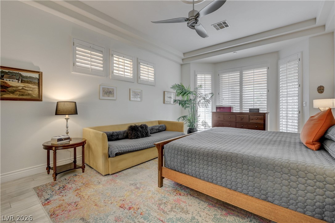 457 Indigo Springs Street Henderson, NV 89014 - Photo 17 of 58 Primary bedroom with shuttered windows.