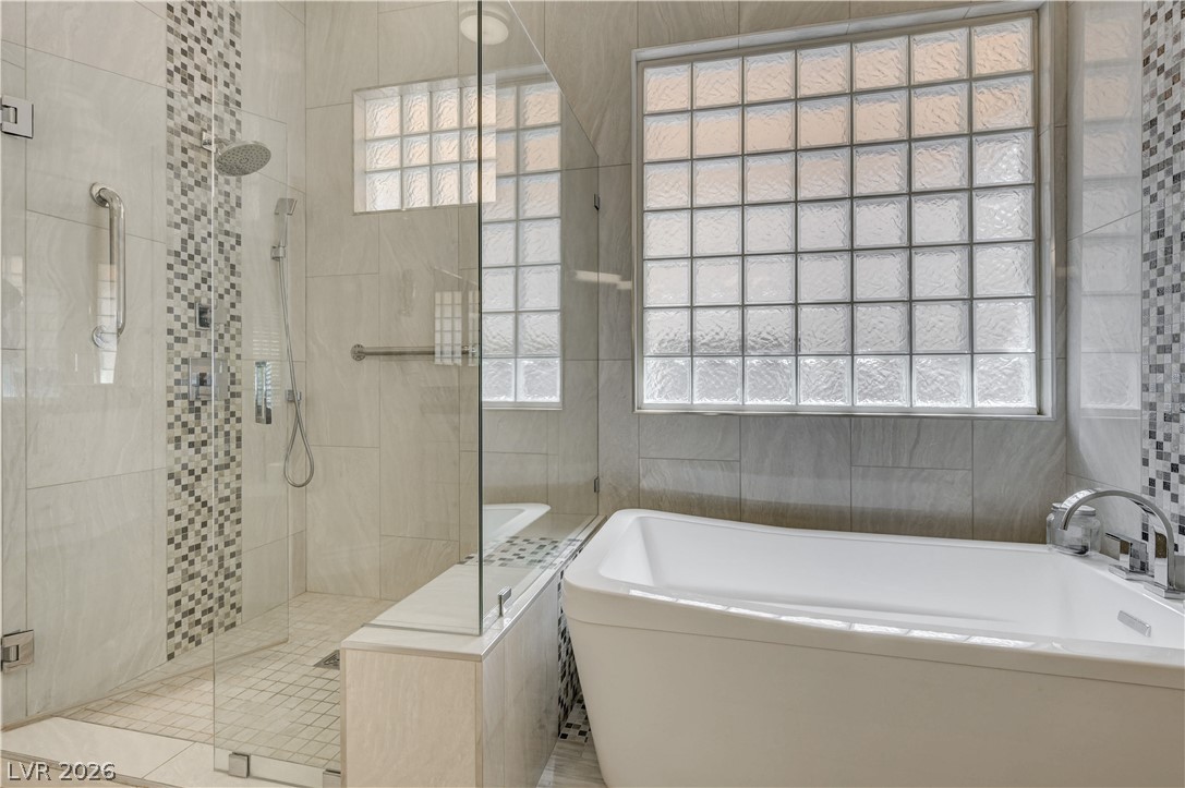 457 Indigo Springs Street Henderson, NV 89014 - Photo 20 of 58 Luxurious soaking tub, glass enclosed walk in shower.
