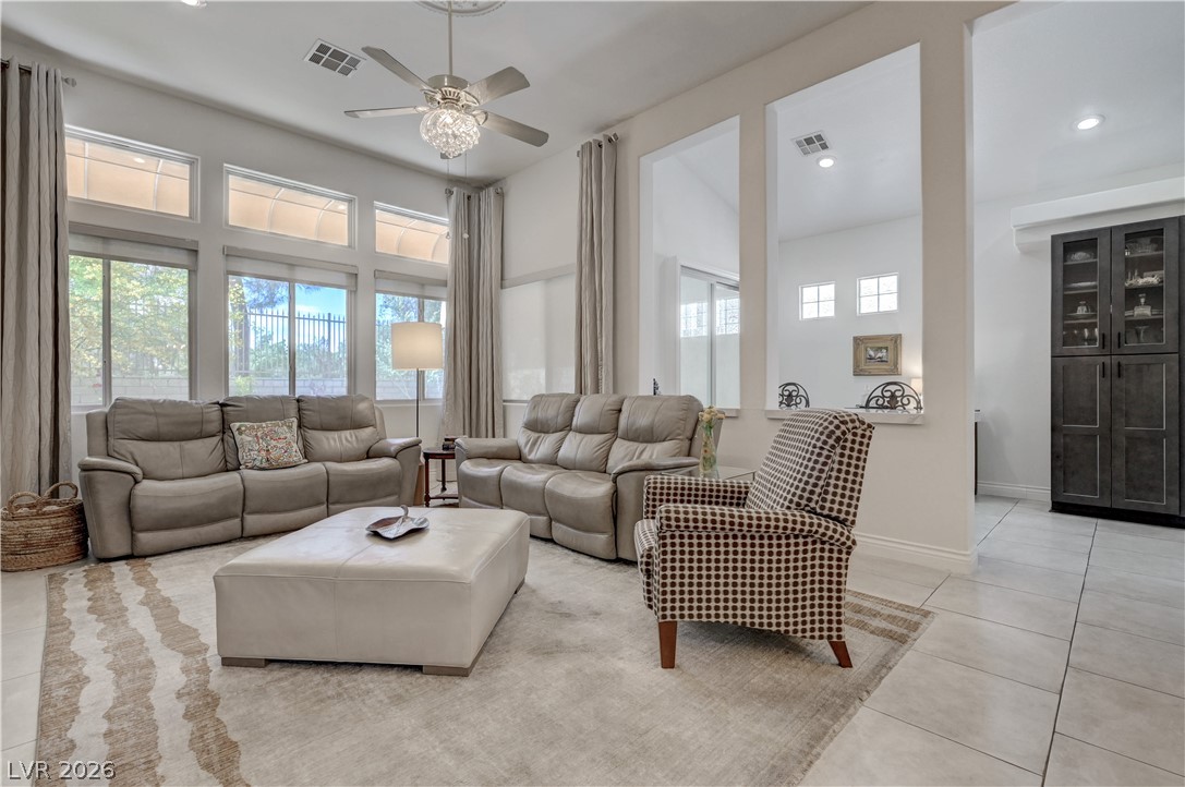 457 Indigo Springs Street Henderson, NV 89014 - Photo 5 of 58 Living area backs up to kitchen bar area providing more seating and easy viewing of the television.
