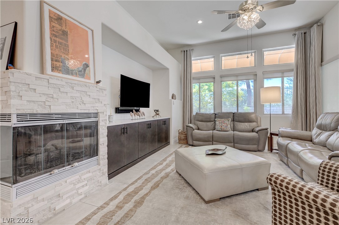 457 Indigo Springs Street Henderson, NV 89014 - Photo 7 of 58 Gas fireplace adds to the rooms comfort.