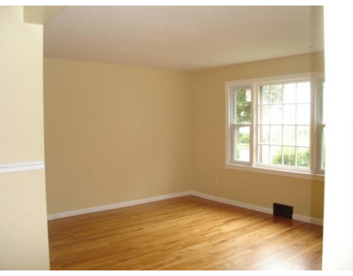 6 Alsace Street Springfield, MA 01108 - Photo 3 of 11 an empty room with wooden floor and windows