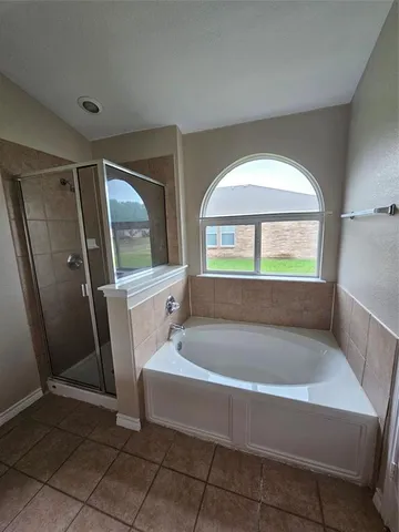 a bathroom with a bathtub and a sink