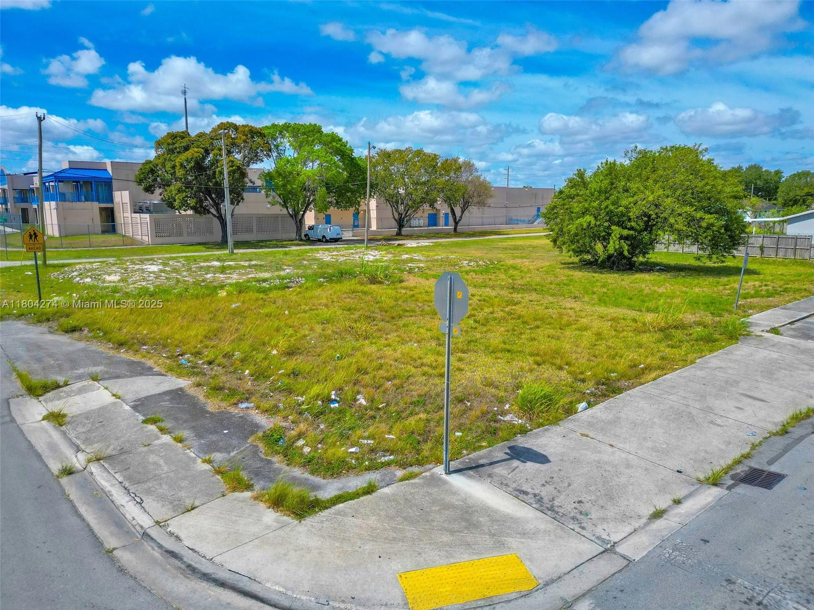402 Southwest 6th Street Homestead, FL 33030 - Photo 11 of 12 a view of a swimming pool with a yard