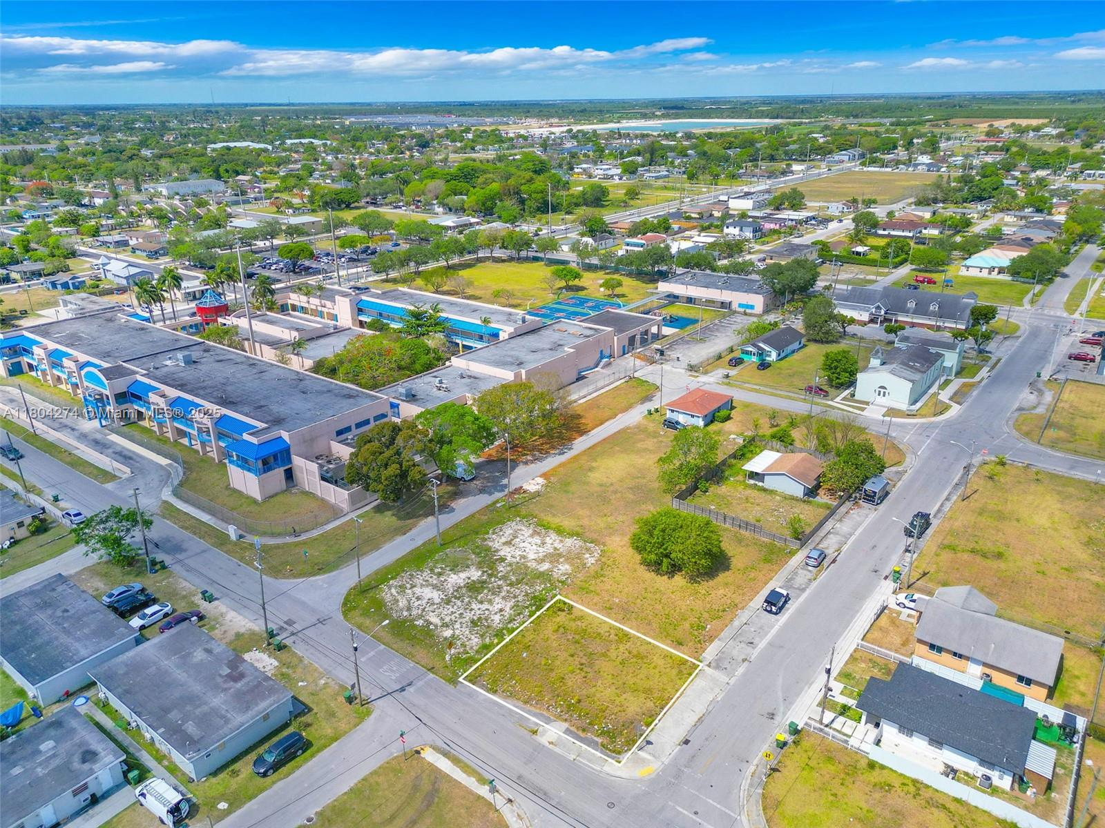 402 Southwest 6th Street Homestead, FL 33030 - Photo 2 of 12 an aerial view of residential houses with outdoor space