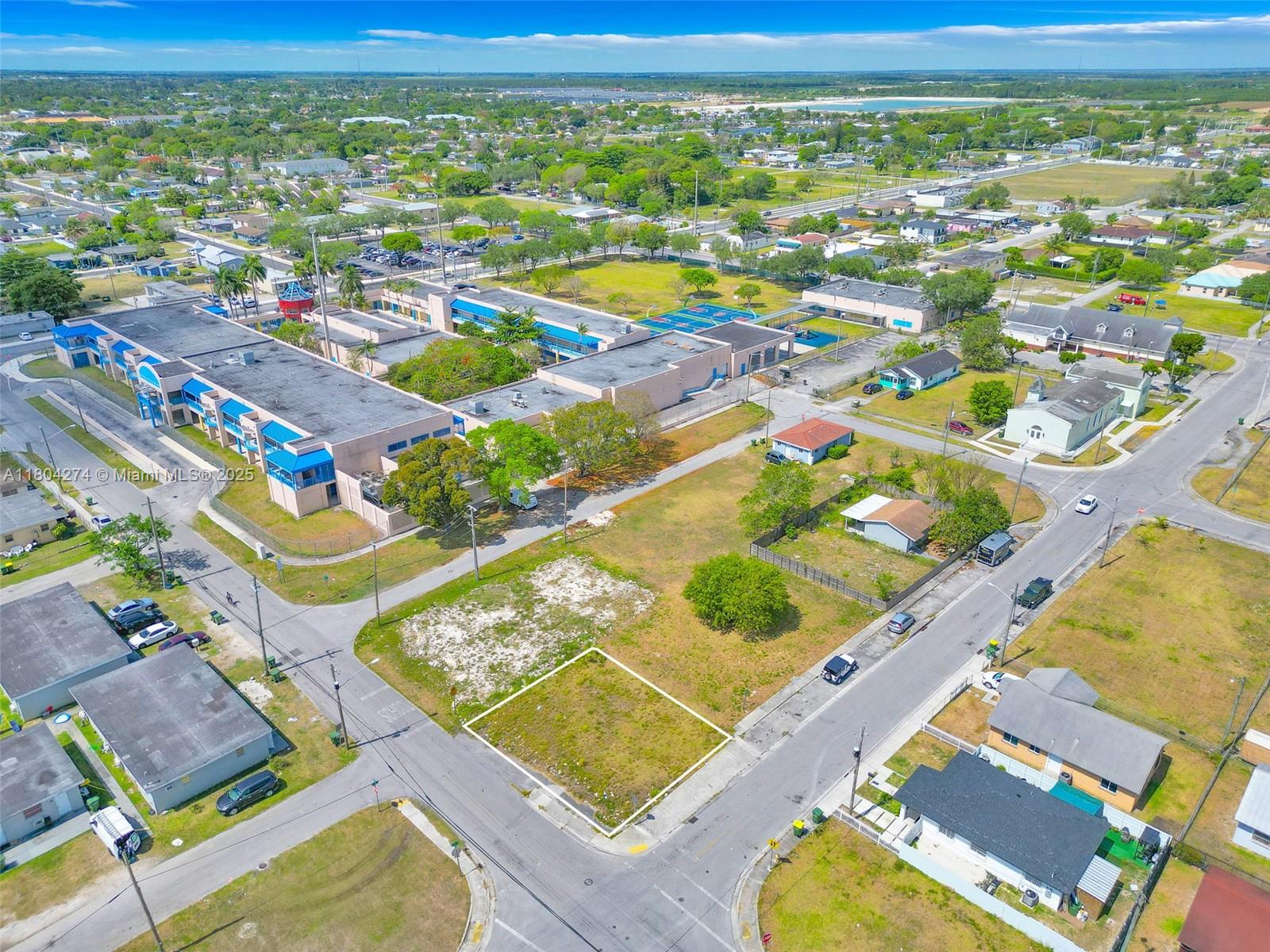 402 Southwest 6th Street Homestead, FL 33030 - Photo 5 of 12 an aerial view of residential houses with outdoor space