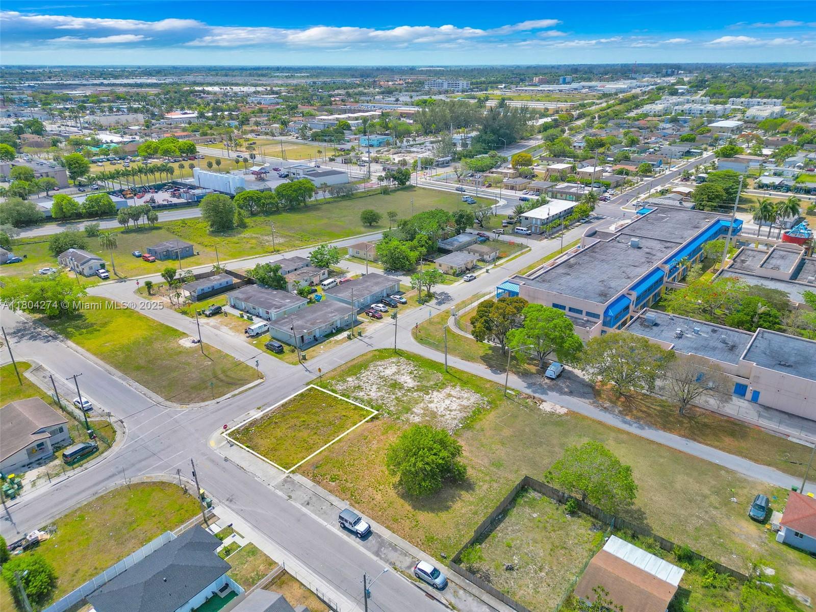 402 Southwest 6th Street Homestead, FL 33030 - Photo 9 of 12 an aerial view of residential houses with outdoor space
