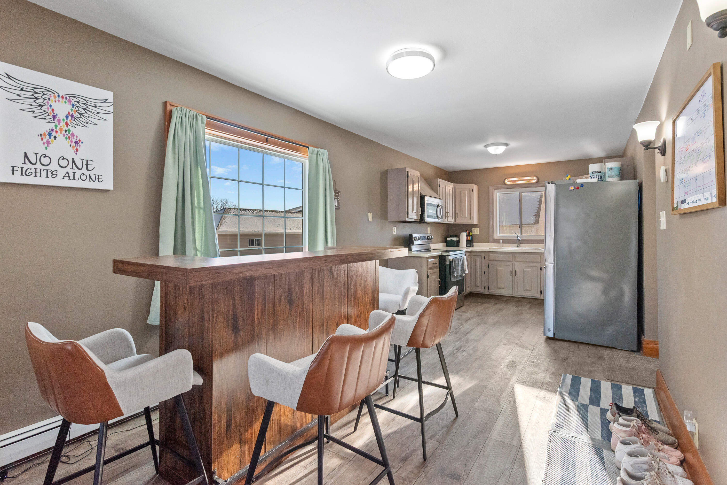 115 Elm Street Kewaskum, WI 53040 - Photo 6 of 18 Open concept! Kitchen, dining and living room all flow together!