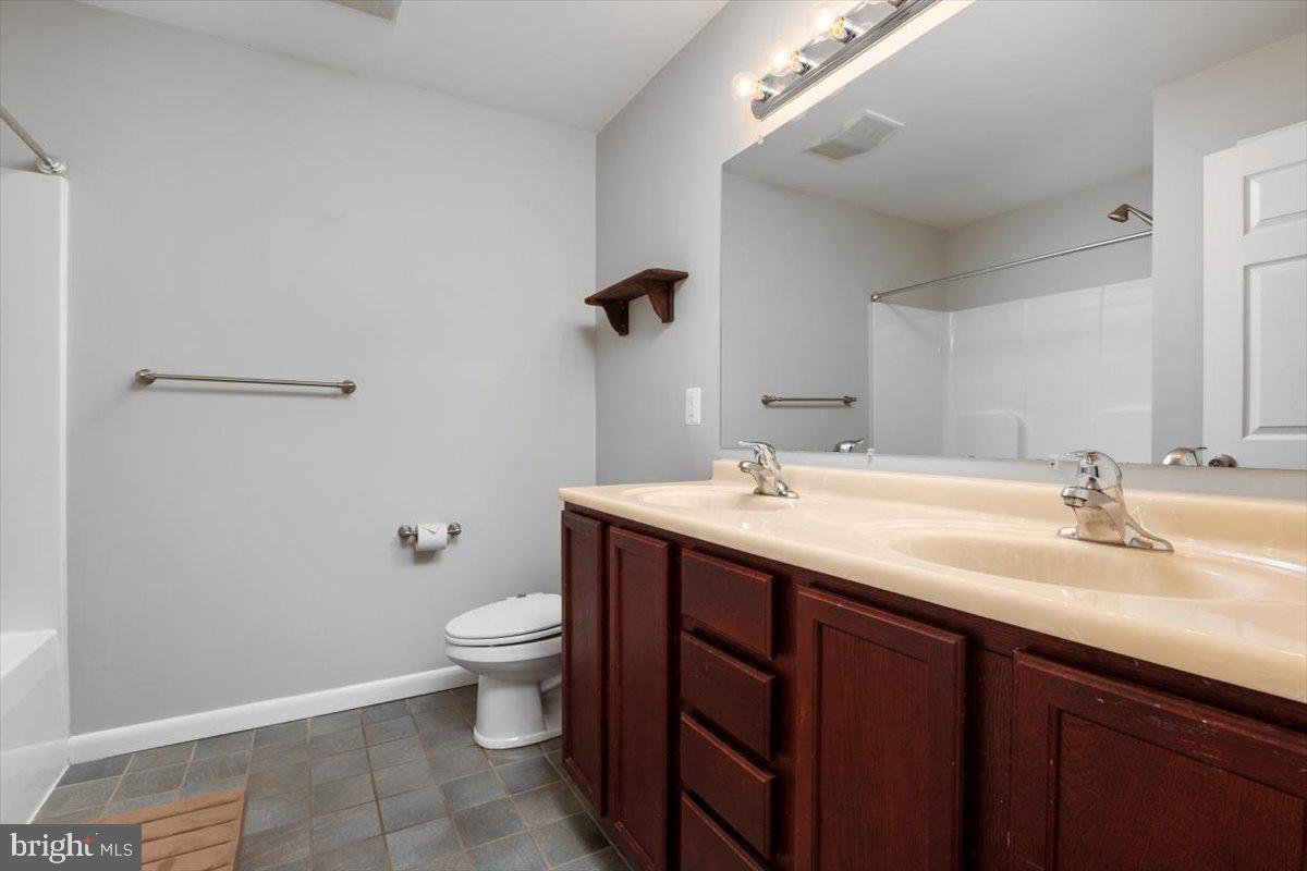 1232 Perrys Corner Road Grasonville, MD 21638 - Photo 20 of 35 Hall Full bath w/ tile floors & double vanity