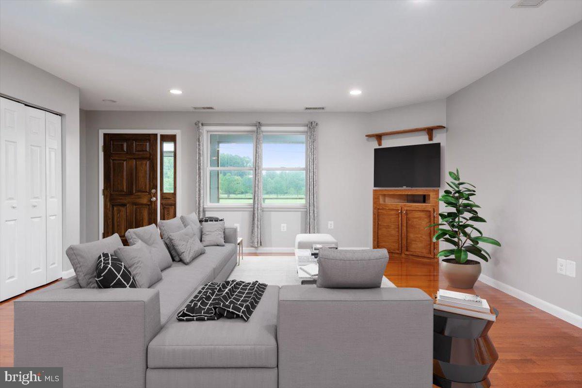 1232 Perrys Corner Road Grasonville, MD 21638 - Photo 8 of 35 Natural light illuminates the family room