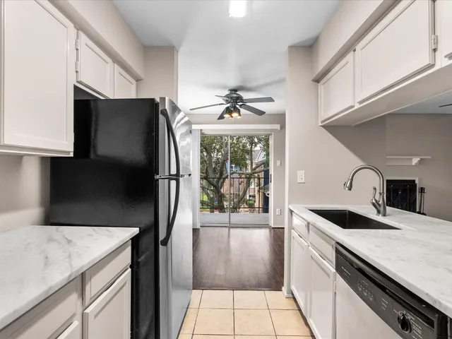 a view of a kitchen cabinets a sink and dishwasher in a kitchen