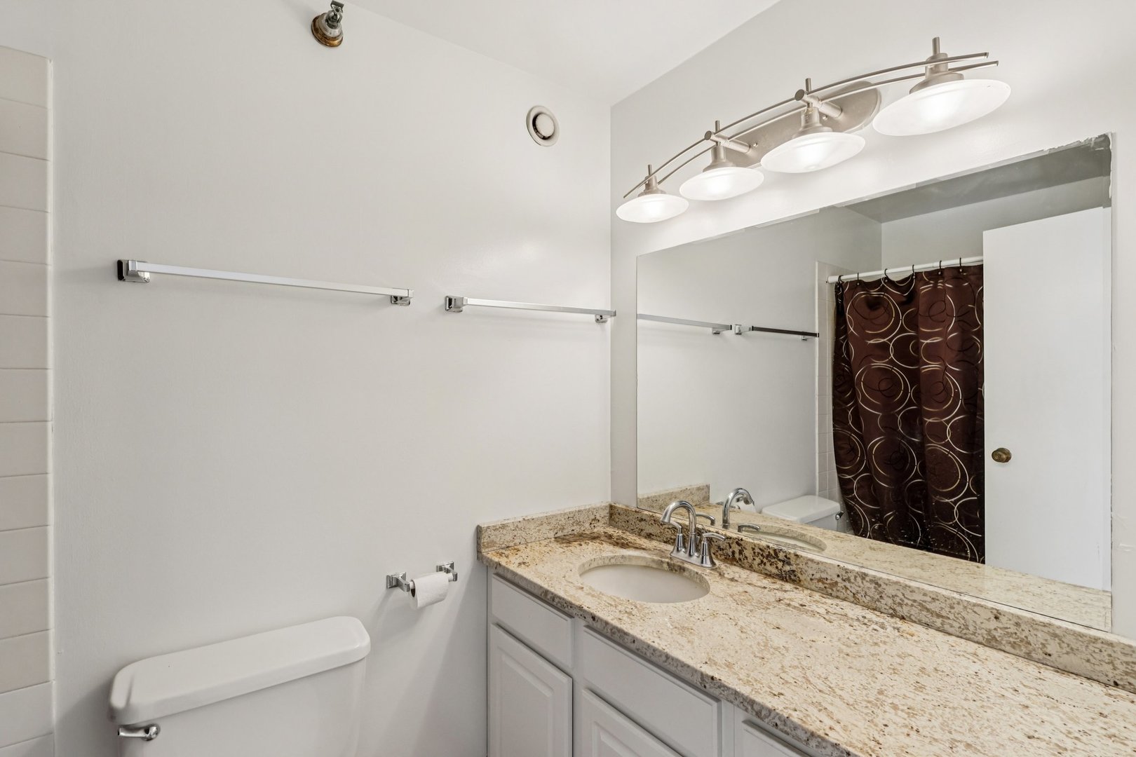 70 West Huron Street, Unit 2210 Chicago, IL 60654 - Photo 12 of 18 a bathroom with a granite countertop sink toilet and shower