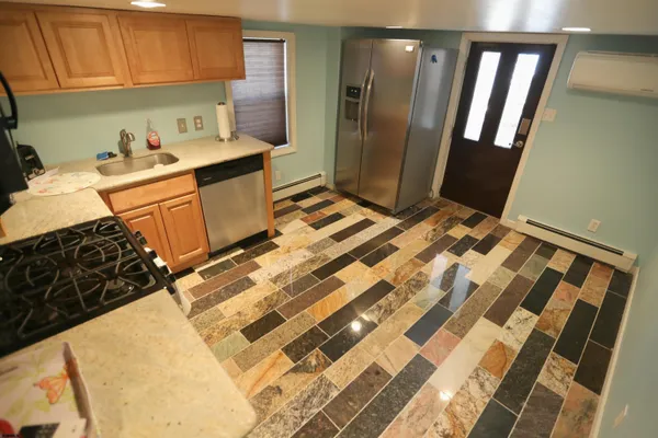 a kitchen with a sink and a refrigerator