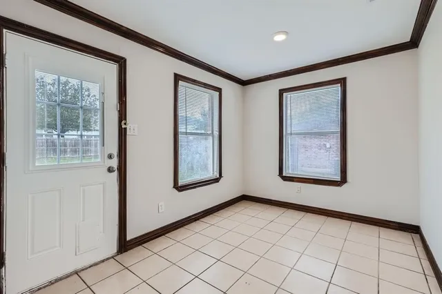 a view of an empty room and window