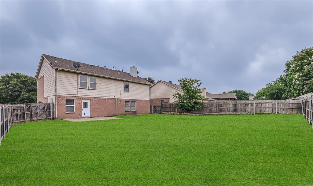 1406 Buckingham Drive Forney, TX 75126 - Photo 24 of 30 a house view with a garden space