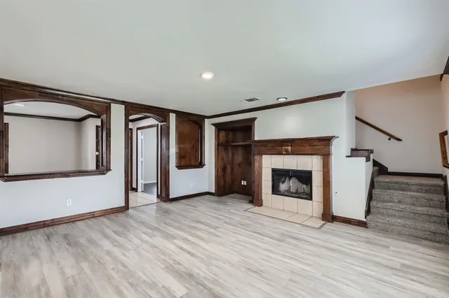 a view of a refrigerator in kitchen and wooden floor