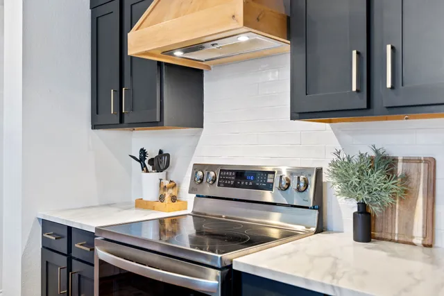 a kitchen with a stove and a microwave