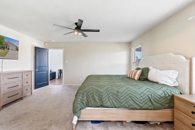 a bedroom with a bed and a cabinets