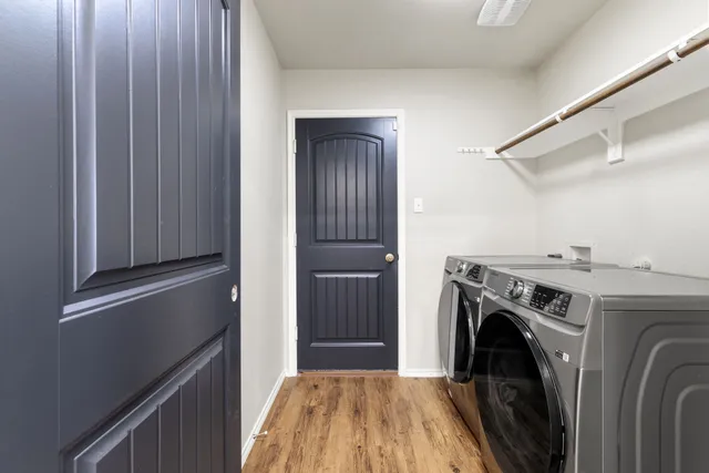 a view of a kitchen with washer and dryer