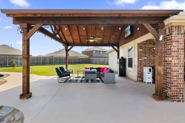 a view of a swimming pool with a patio