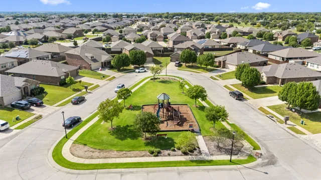 a view of a house with outdoor space and a lake view