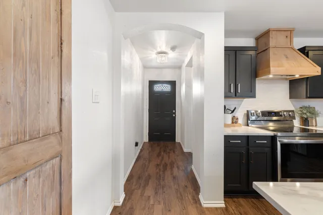 a view of a kitchen from the hallway